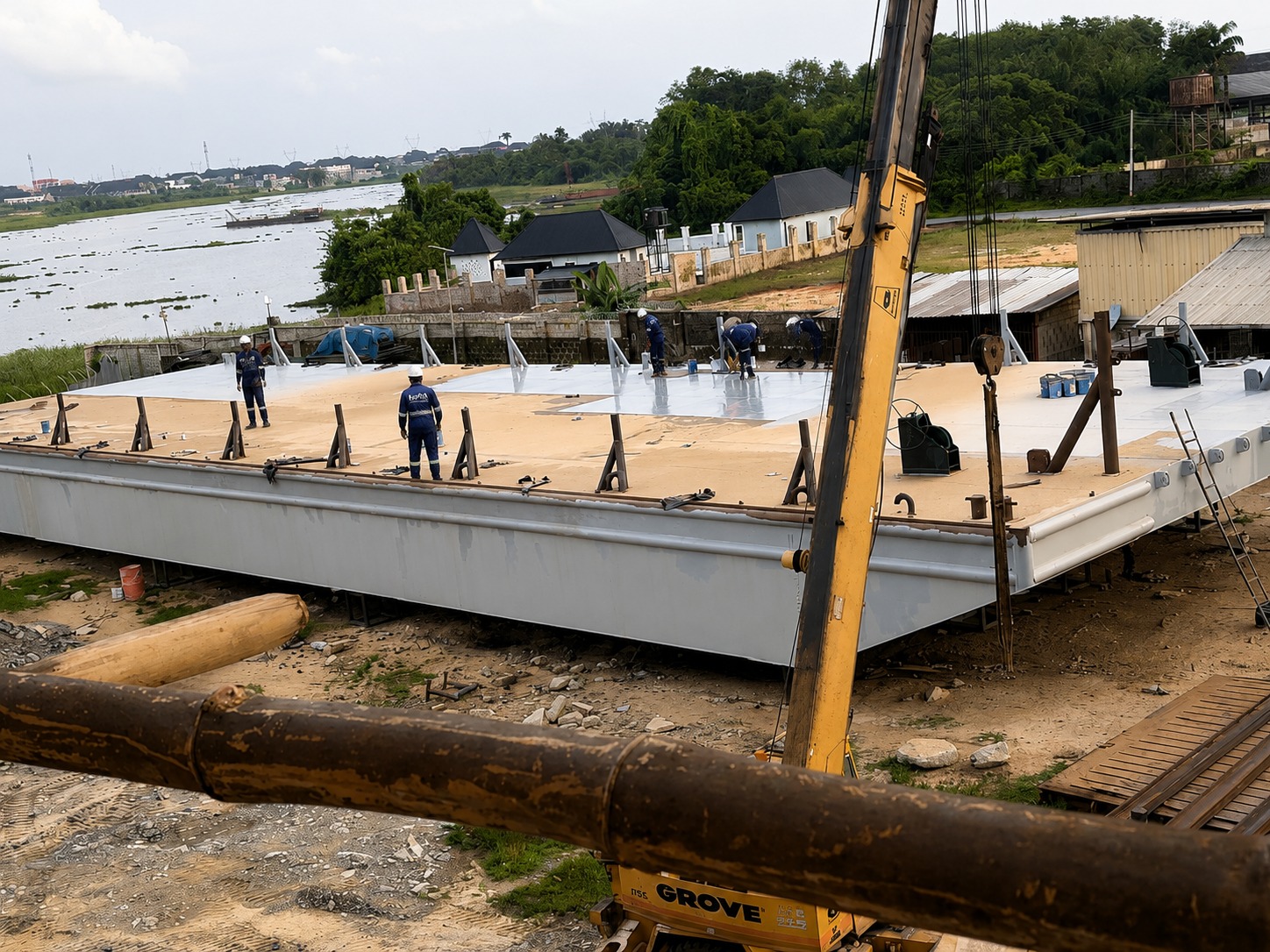 Kortch team completing deck outfitting on a marine barge under construction
